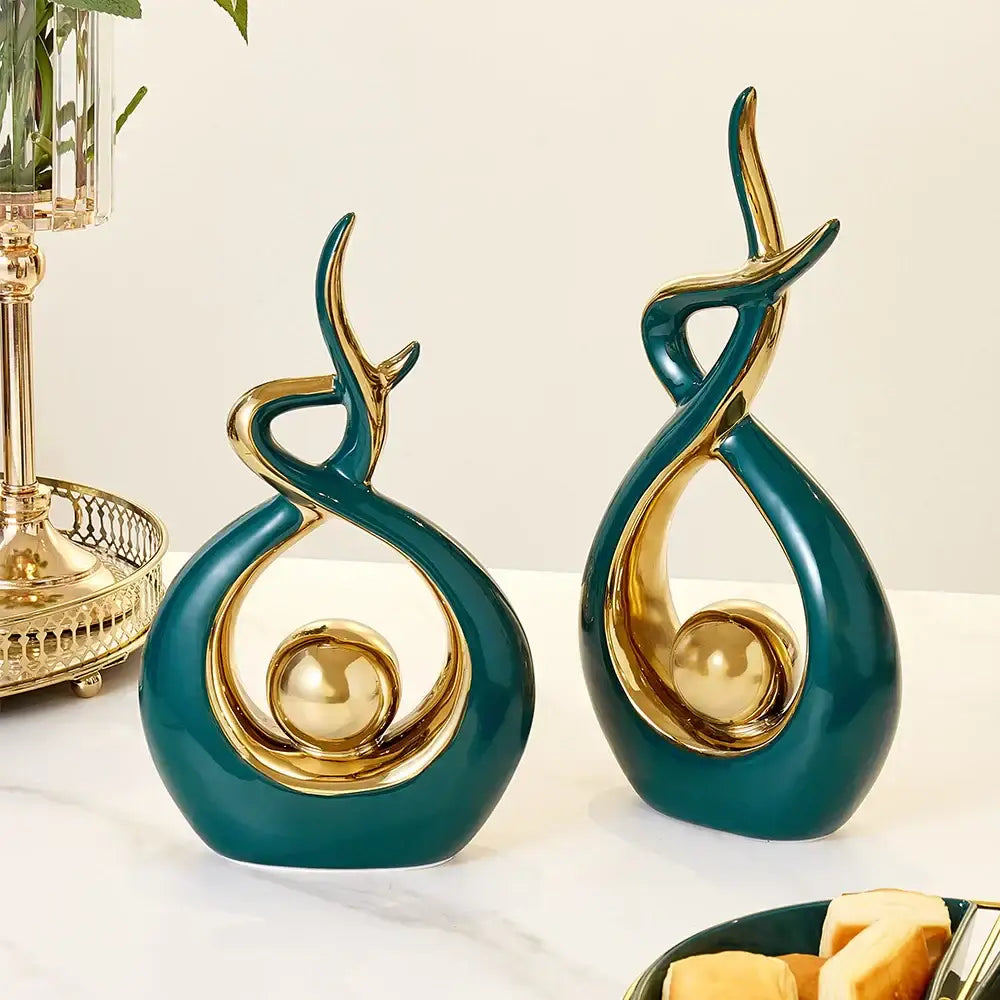 Teal and gold ceramic abstract figurine set with flowing intertwined design in decorbites ceramic abstract living room decor