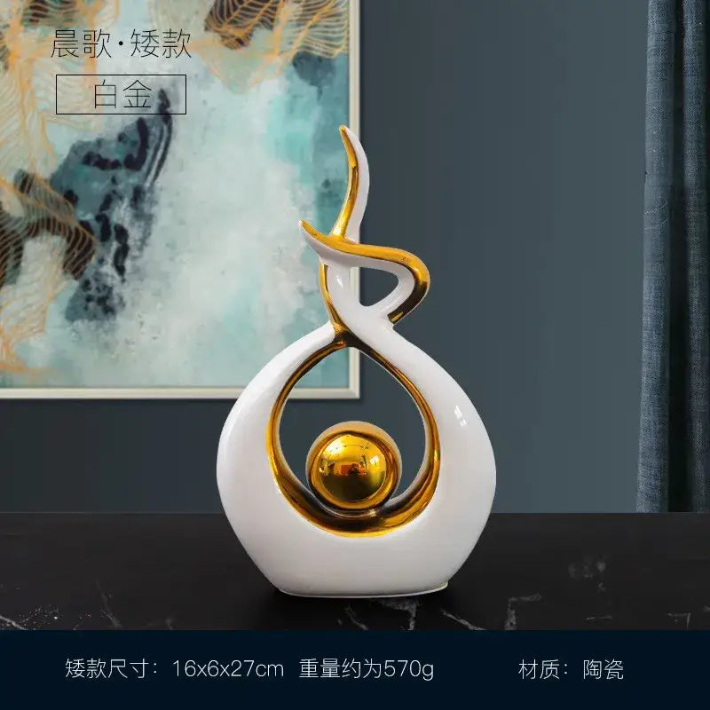 White and gold ceramic abstract figurine set with glossy finish and swirling design for living room decor by decorbites