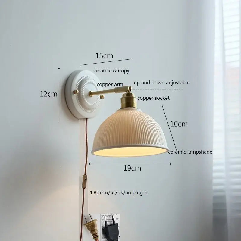 Cream-colored ceramic led wall light with ribbed lampshade and brass-finished copper arm for bedroom decorbites ceramic led wall