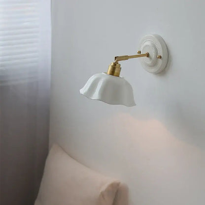 White and gold ceramic led wall light with metal arm and decorative base for bedroom decorbites ceramic led wall use