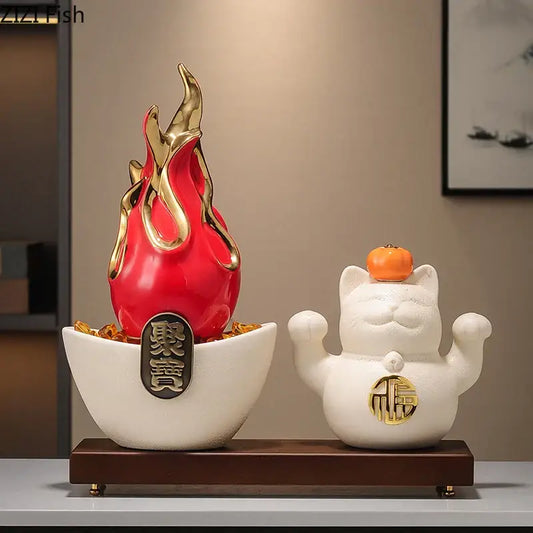 White and gold ceramic lucky cat feng shui ornament with a small orange persimmon for living room decor