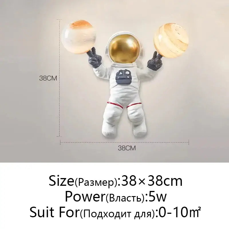 White and gold decorbites astronaut moon wall lamp with gold helmet, white suit, black gloves, holding moon planet table lights