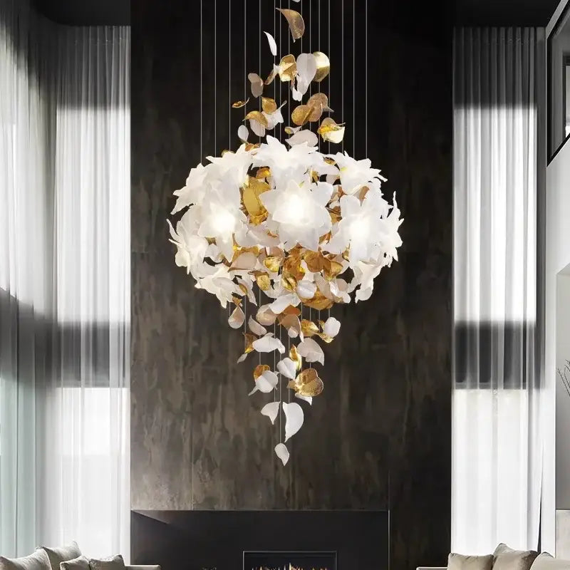 A white and gold decorbites crystal flower chandelier with leaf-shaped elements for living room lighting