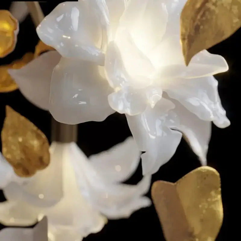 Translucent white ceramic flower with glossy petals and gold leaf accents in decorbites crystal flower chandelier light