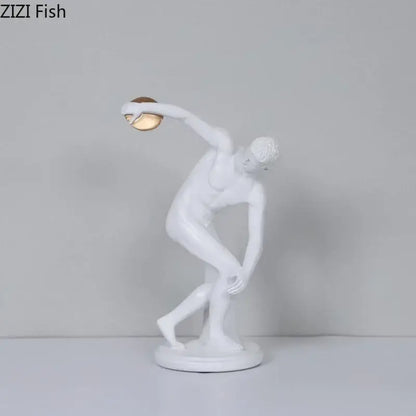 White and gold discus thrower resin sculpture depicting male athlete in mid-throw for living room decor