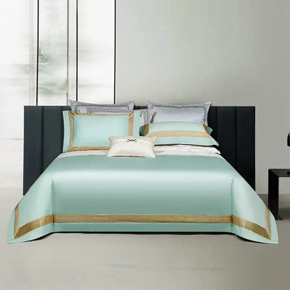 Luxurious mint green satin bedspread with gold embroidery and geometric trim in white and gold egyptian cotton bedding set