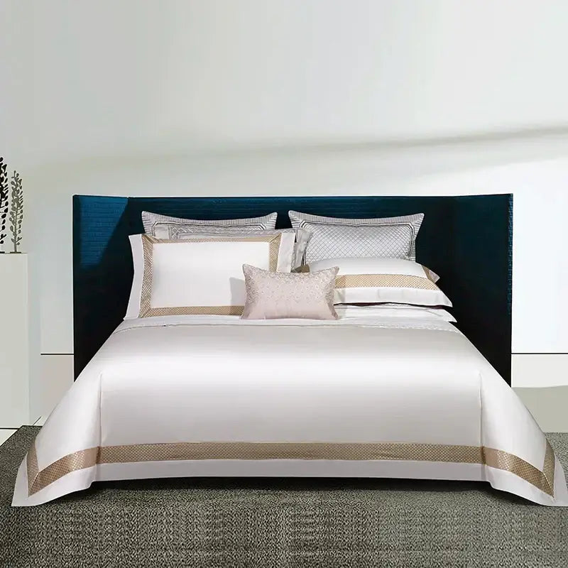Elegant white satin egyptian cotton bedding set with gold embroidery and matching pillowcases for bedroom use