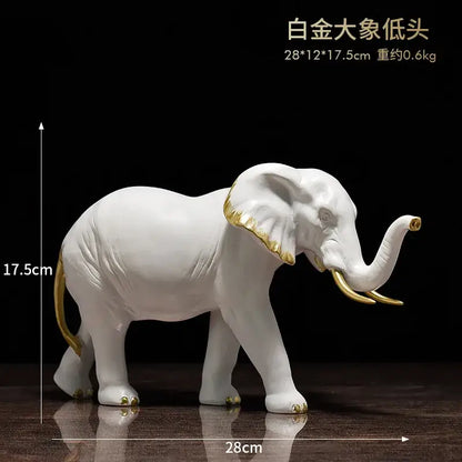 White and gold elephant resin sculpture ornaments with ceramic finish for living room decor by decorbites elephant resin