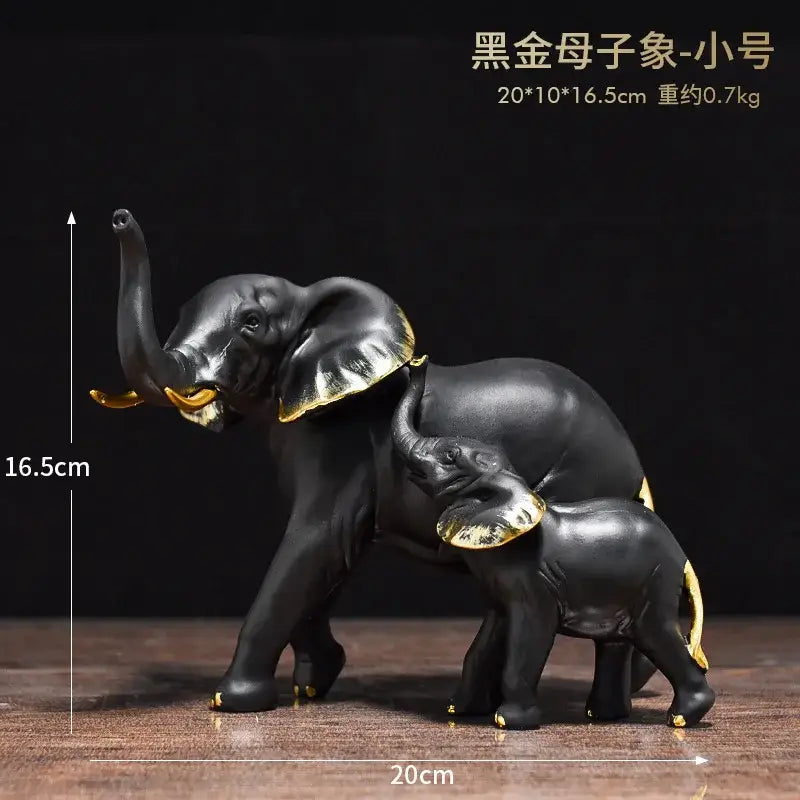 Black mother and baby elephant resin sculpture ornaments with gold-trimmed ears tusks and feet for living room decor