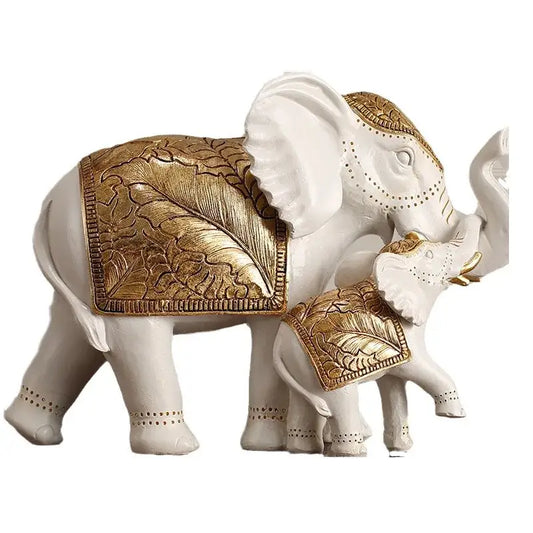 White and gold elephant sculpture figurine with intricate gold leaf-patterned saddles for living room decor