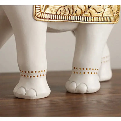 White and gold elephant sculpture figurine showing the back with gold-embossed decorative details for living room decor