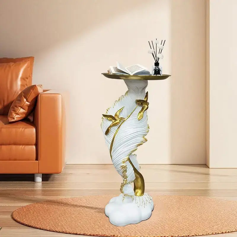 White and gold feather floor decoration side table with feather texture, cloud base, and circular brass tray top