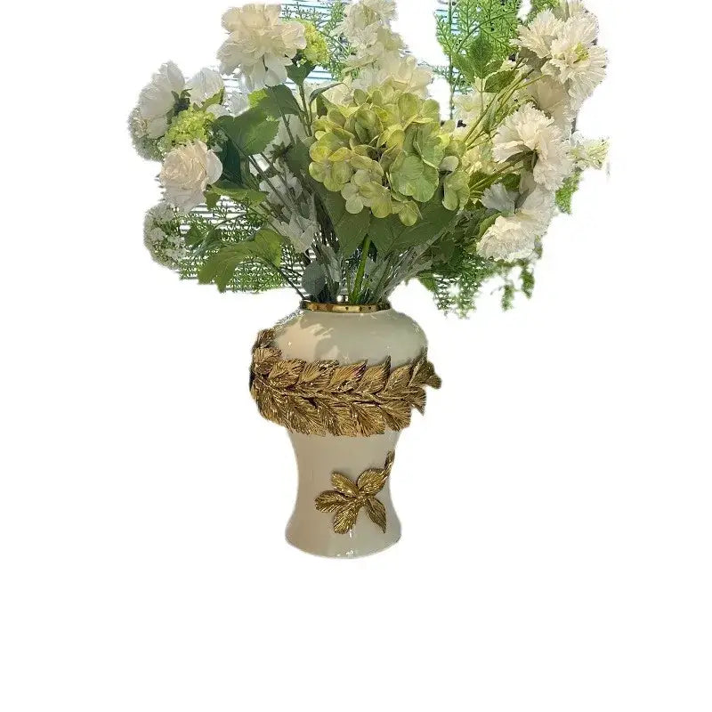 Cream-colored leaves ceramic flower vase with golden leaves ceramic embellishments and white green artificial flowers decorbites