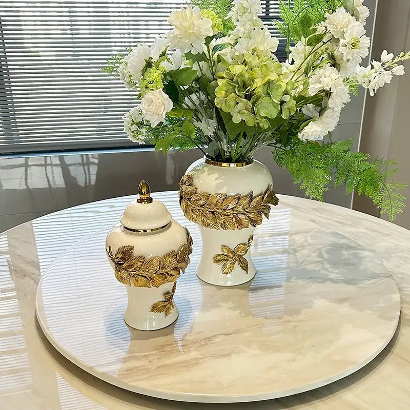 White and gold leaves ceramic flower vase with decorbites golden leaves embellishments and matching lid for living room decor