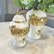 White ceramic flower vase with golden leaves and butterfly accents ideal for living room decorbites golden leaves decor