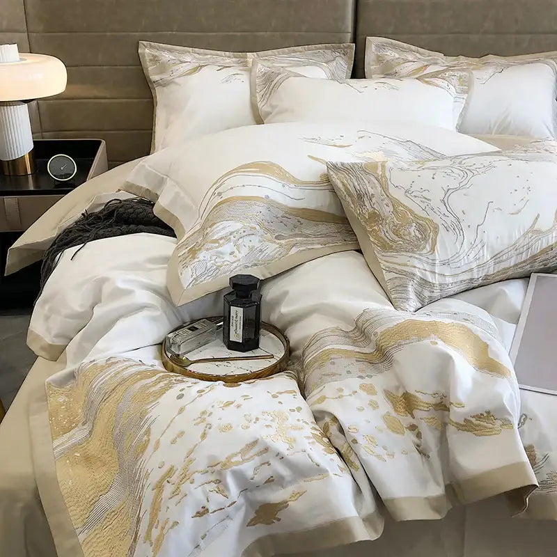 Elegant white and gold marble-patterned satin egyptian cotton luxury bedding set with subtle metallic sheen for bedroom