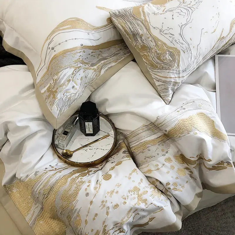 White and gold marble-patterned egyptian cotton luxury bedding set with elegant flowing designs for bedroom use