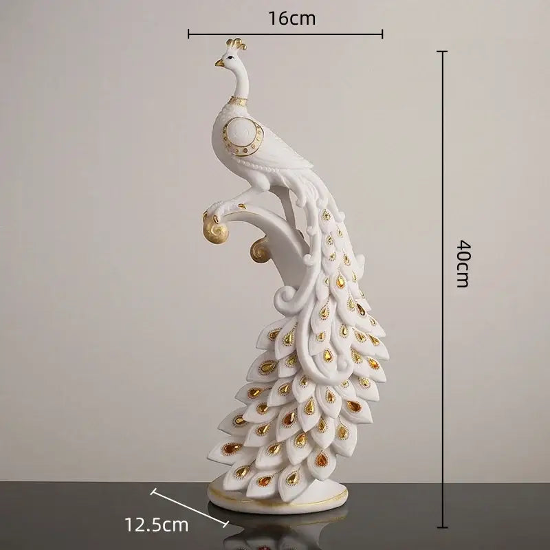 Elegant white and gold peacock sculpture with eye-like tail markings on decorative base for home decor by decorbites golden phoenix