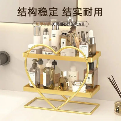 White and golden heart-shaped two-tier metal shelf holding beauty products decorbites golden makeup organizer