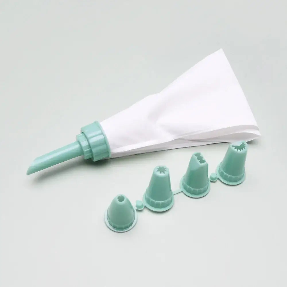 Mint green plastic cake cream decorating gun with white paper liner and four matching piping tips for decorbites cream decorating