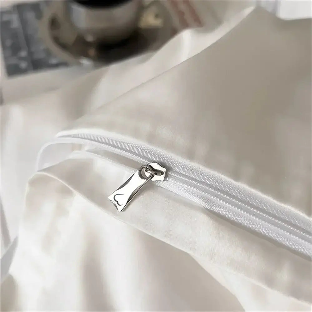 White satin pillowcase with silver zipper pull part of white and gray egyptian cotton bedding set decorbites 1200tc embroidered