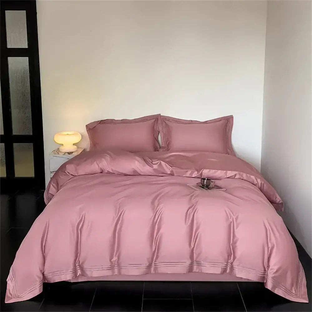 Soft pink satin bedding set with subtle stitched detailing complementing white and gray egyptian cotton decorbites 1200tc embroidered duvet cover