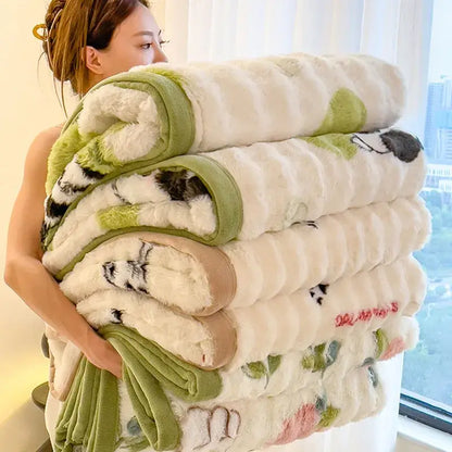 Stack of cream-colored cartoon printed faux rabbit plush blankets with green and black floral patterns for bedroom decorbites cartoon printed