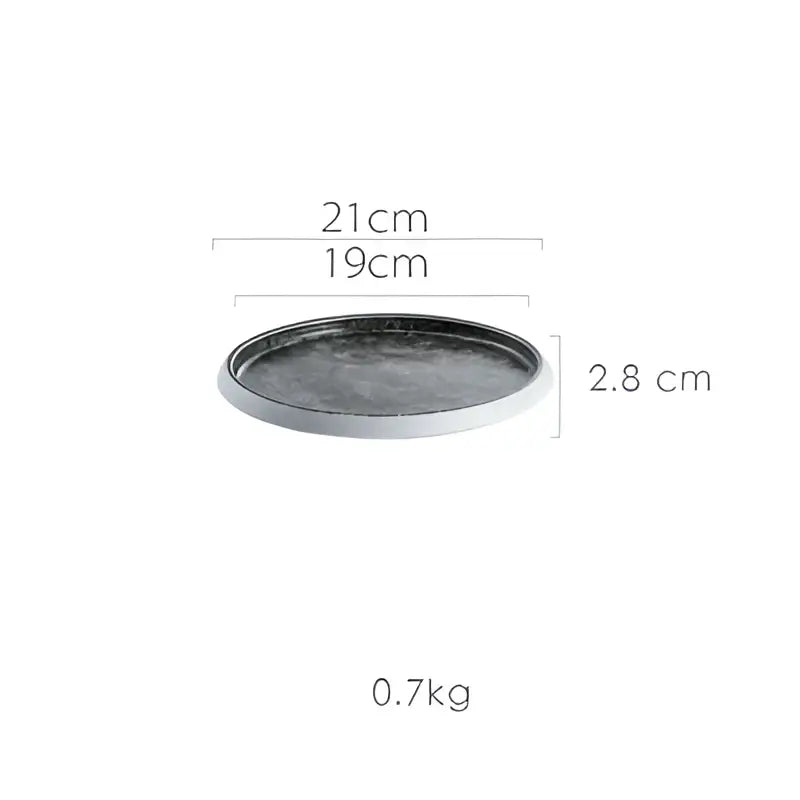 Dark gray ceramic circular tray with metallic rim featuring ice cracked glaze from decorbites crack glazed set