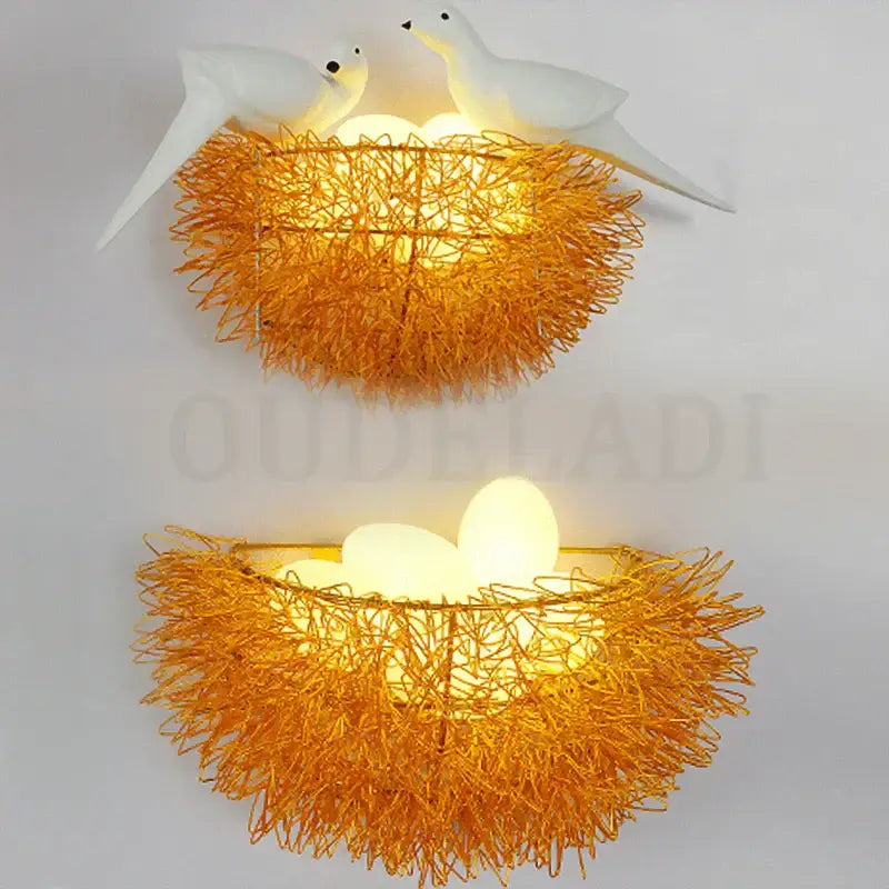 White and orange bird nest led wall lamp with woven design glowing eggs and decorative white bird figurines for bedroom use