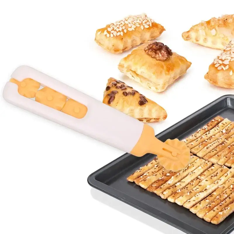 White and orange decorbites dough roller cutter with scalloped head cutting seeded breadsticks on wooden board