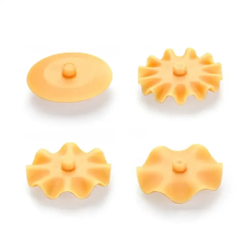 Set of four orange silicone sink strainers with petal designs paired with white and orange decorbites dough roller cutter