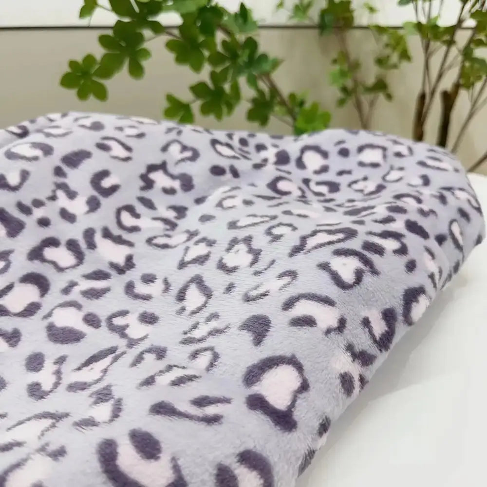A soft plush gray fleece throw with subtle dark and light leopard print warm decorbites leopard print blanket