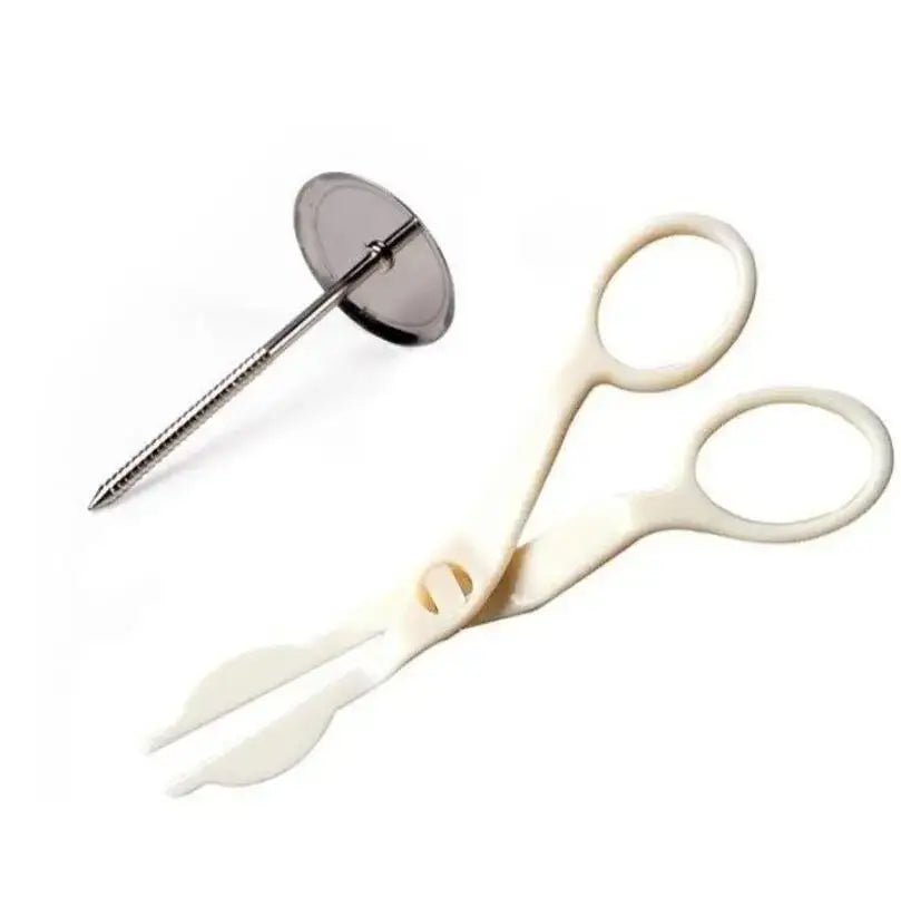 White plastic cake server with serrated blades and metallic cake pick in decorbites cream flower scissors set