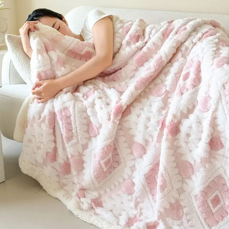 A plush white and pink geometric jacquard taff velvet blanket with a soft textured design for bedroom decorbites