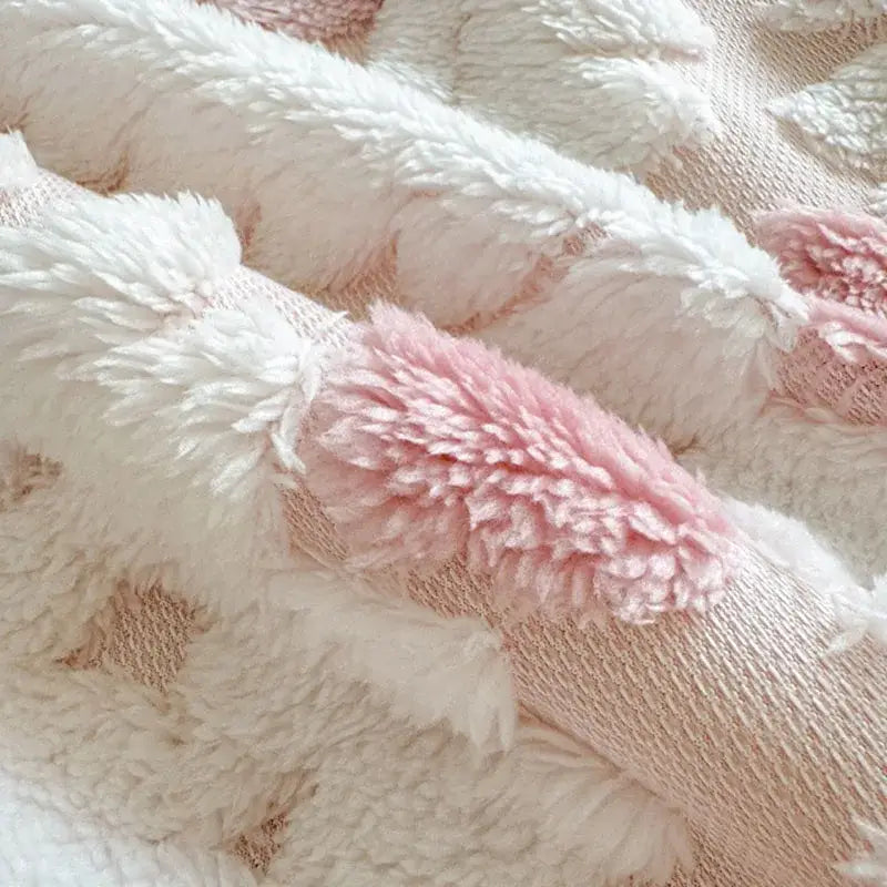 White and pink plush bunny ears with fluffy texture on subtle knit background complement decorbites geometric jacquard taff velvet blanket