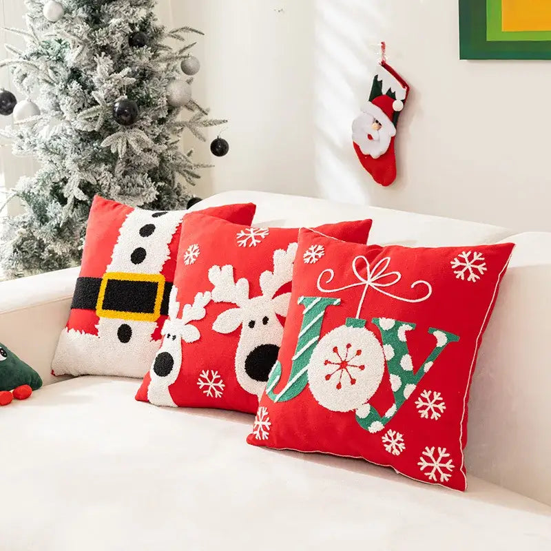 Red embroidered christmas pillow with white snowflakes reindeer design and green joy lettering for living room decorbites decor