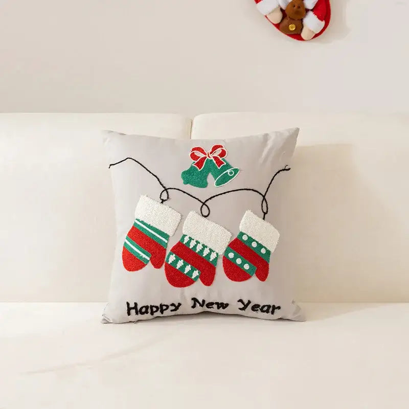 Gray embroidered christmas pillow with red and green mittens bell bow and happy new year text for living room decor