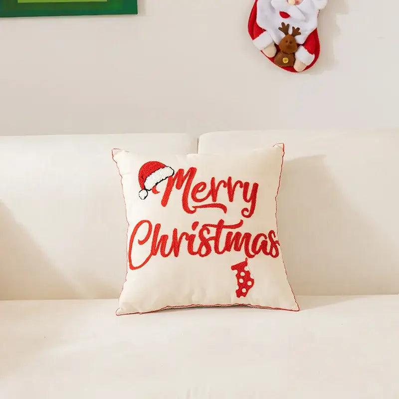 Cream-colored embroidered christmas pillow with red merry christmas text santa hat and candy cane for living room decor