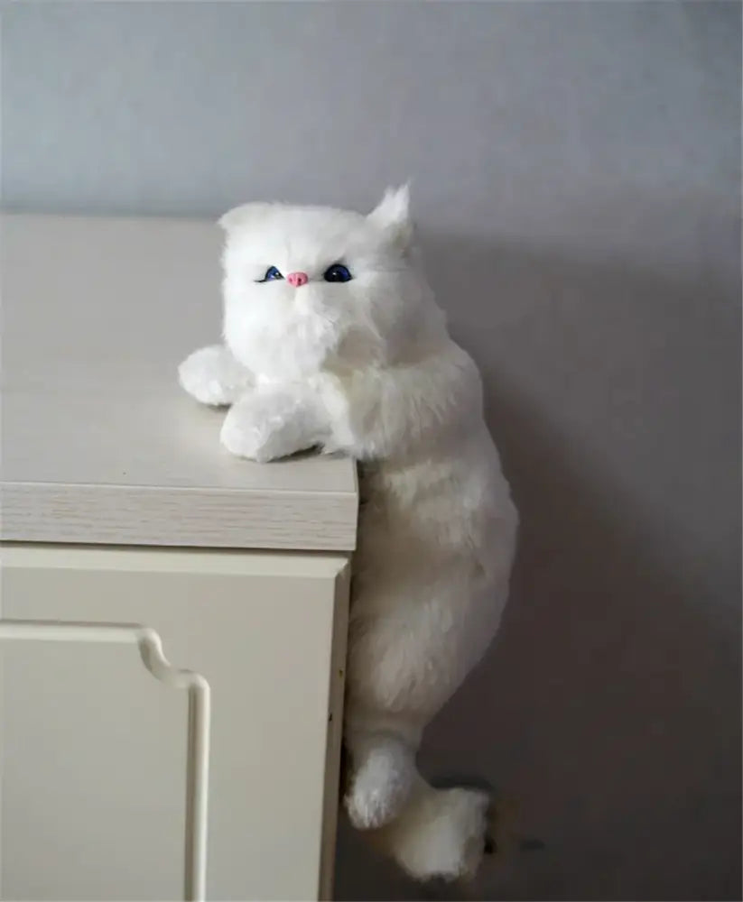 A white and tan hanging cat plush doll with blue eyes and pink nose made from soft synthetic fur for decorbites hanging cat decor