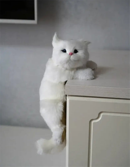A white and tan hanging cat plush doll made of soft synthetic fur featuring black eyes and a pink nose for decorbites hanging cat decor