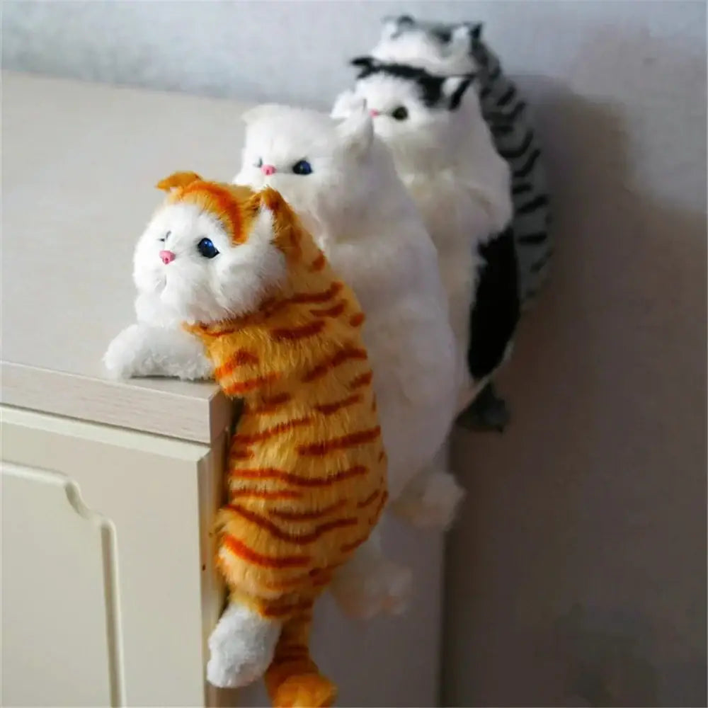 White and tan hanging cat plush doll with orange and white stripes and blue eyes designed as decorbites hanging cat for living room decor