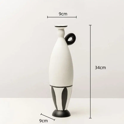 White ceramic vase with black handle and geometric black lines leaf-patterned base for living room decor
