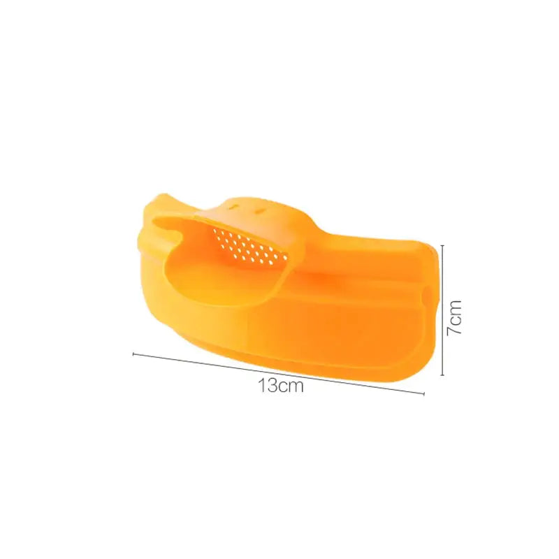 Bright orange silicone fruit corer with perforated top and ergonomic handle for decorbites duck beak funnel use