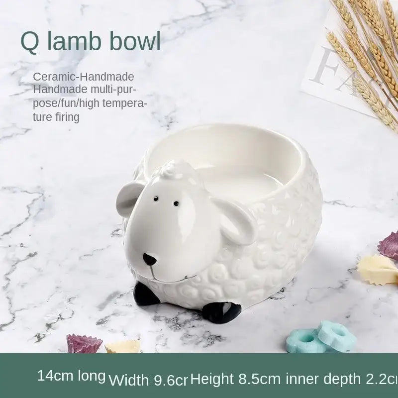 White ceramic lamb-shaped bowl with black hoof accents and textured surface featured in decorbites duck ceramic dessert collection