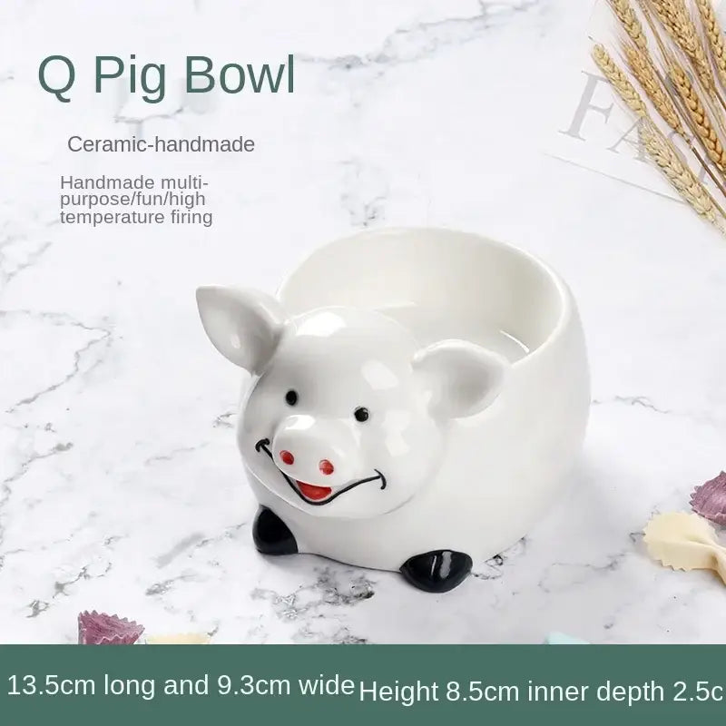 White ceramic pig-shaped dessert bowl with black hooves and red nose for decorbites duck ceramic dessert use
