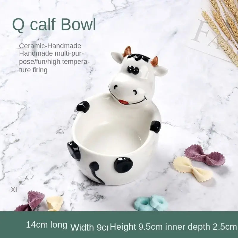 White ceramic dessert bowl shaped like a cow with black spots and brown horns for decorbites duck ceramic collections