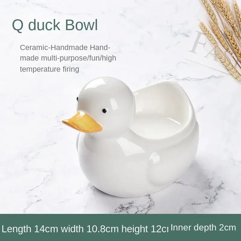 White ceramic dessert bowl with glossy finish and orange beak suitable for decorbites duck ceramic serving dish