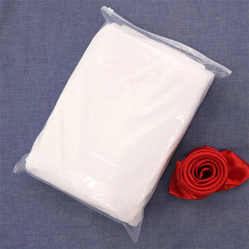 White satin fitted sheet in clear plastic bag with red satin rose for baby elder hypoallergenic waterproof use