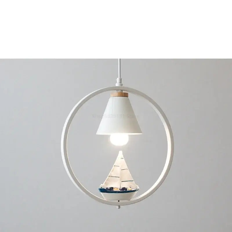 White bird iron ring pendant light featuring a white ceramic circular shade with miniature sailboat decorbites iron ring pendant