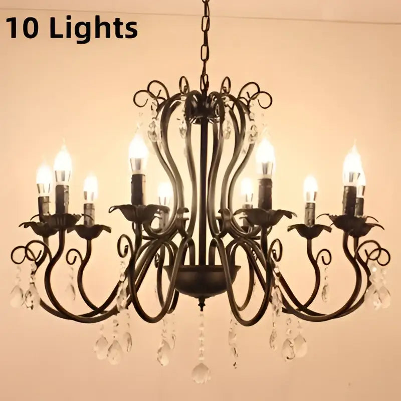 Black white metal chandelier with ten lit candle bulbs and crystal pendants for elegant dining room decorbites design